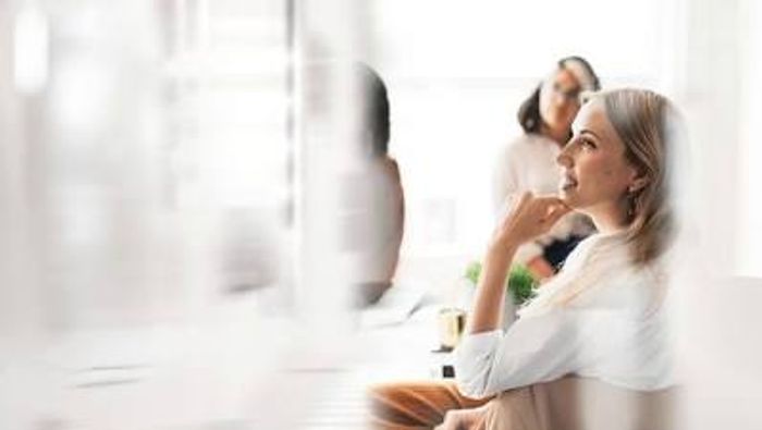 A woman attentively listening during hospice sales