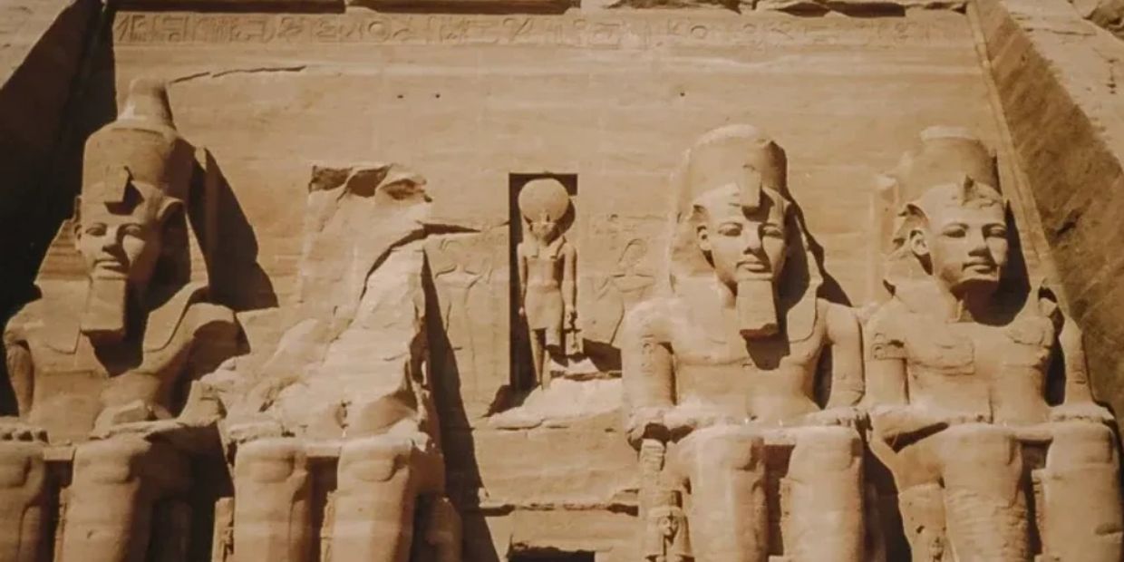Ancient Egyptian statues carved into stone.