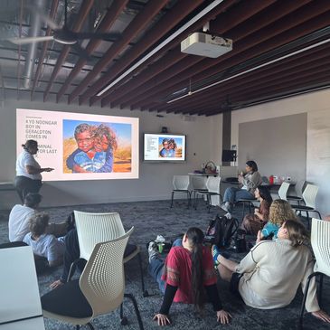 Group attending a presentation in a conference room.