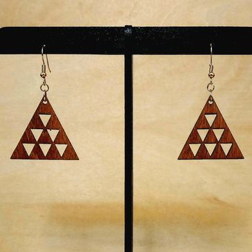 Wooden triangular dangle earrings with cut-out triangle pattern.