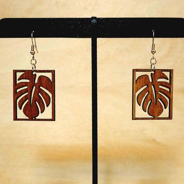 Wooden earrings with leaf design.