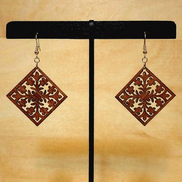 Intricately designed wooden square earrings.