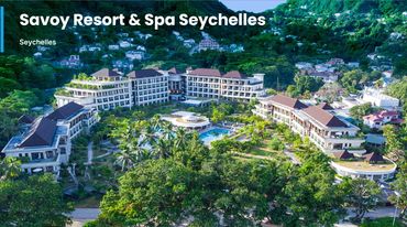 Aerial view of Savoy Resort & Spa in Seychelles surrounded by lush greenery.