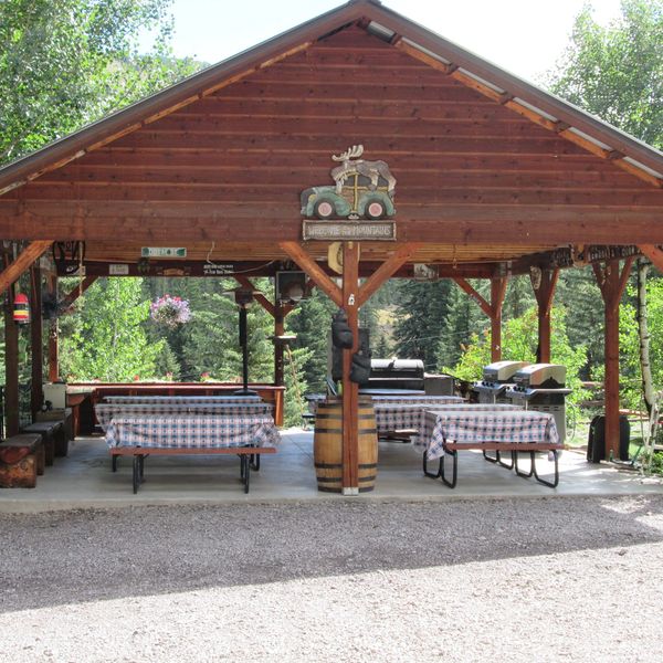 A view of a relaxing gazebo with tables
