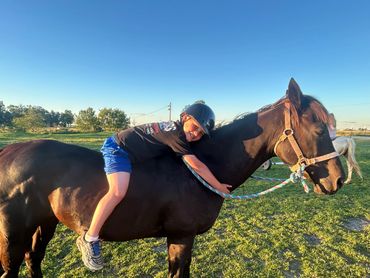The dynamic duo of Axle and Seth. Axle is our off-track thoroughbred who loves the littles.