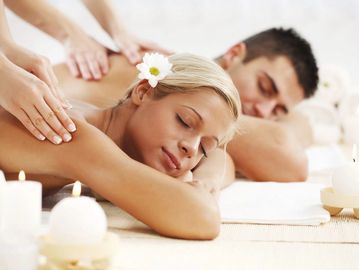 this picture shows two people getting a massage at the same time, signifying a couples massage. $300