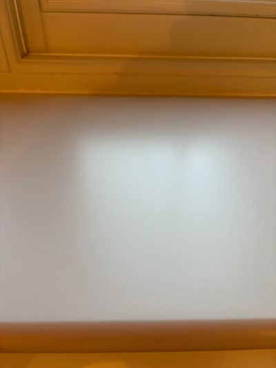 White ceiling with a beige border.