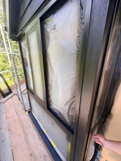 Windows covered during painting preparation.