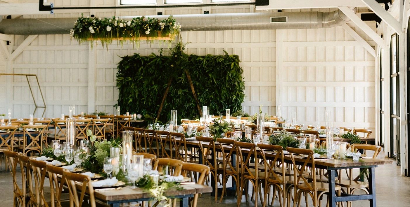 Wedding decorations with tabletop decor florals and candles. Chair rentals and event styling.