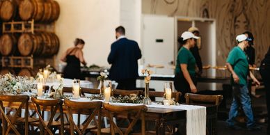 Boxwood Event Rentals team setting up a wedding. Delivery, setup, breakdown services are offered.