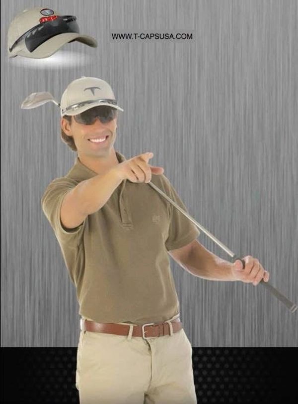 Man in golf attire pointing while holding a golf club.