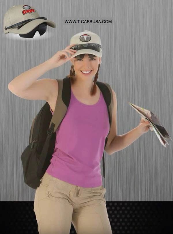 Smiling woman traveler with backpack and cap holding a map.