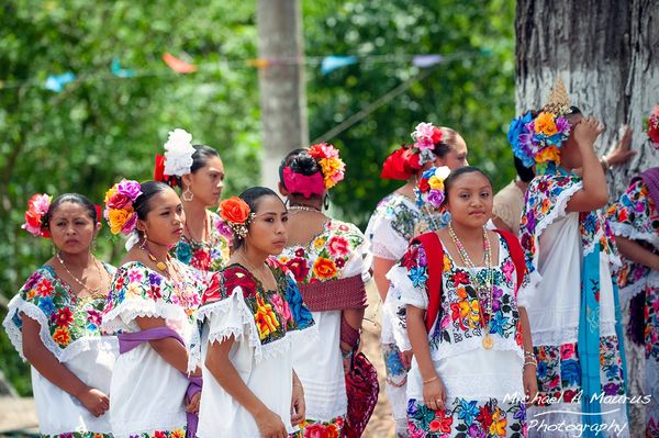 A group of Maya woman dressed in the traditional huipil.
