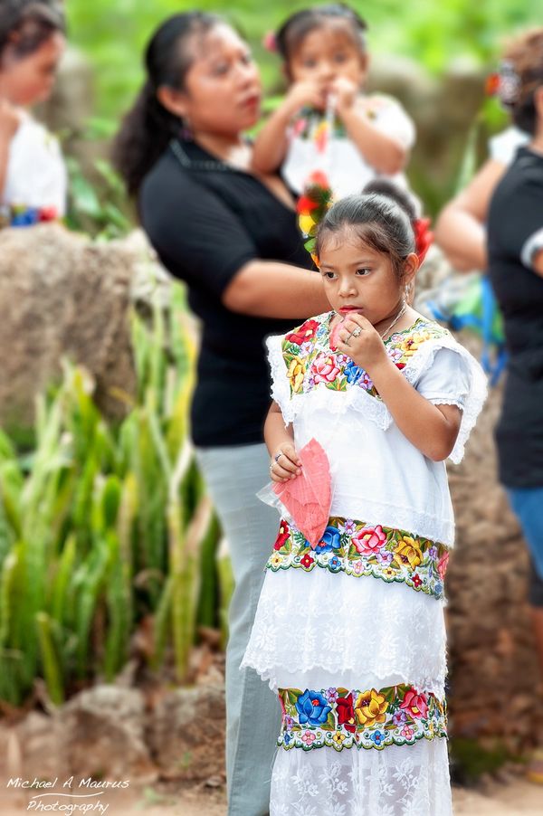 A young Maya girl dressed in a huipil.