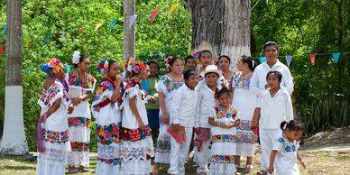 A group of Maya in a festive setting.