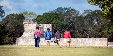 Maya children visiting Chichen Itza.