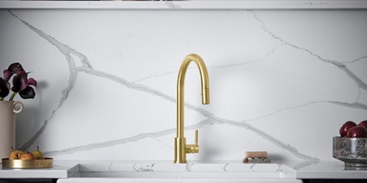 gold faucet white top dark cabinets