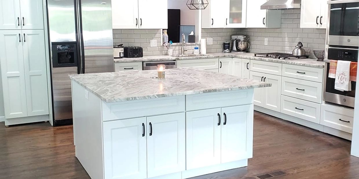 White Shaker Cabinets with Black Handles and White Grey Quartz Top