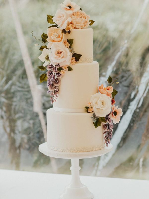 Delicate three tier white wedding cake with sugar wisteria and roses - Sprivers Mansion