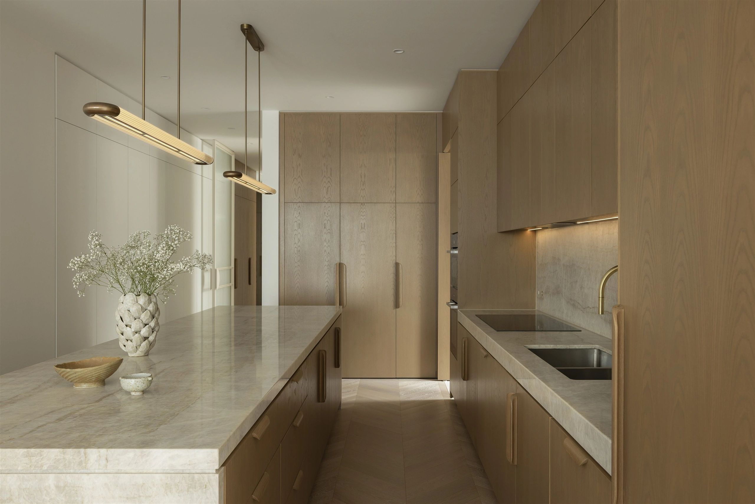 Manhattan Residence kitchen with natural stone island and oak joinery
