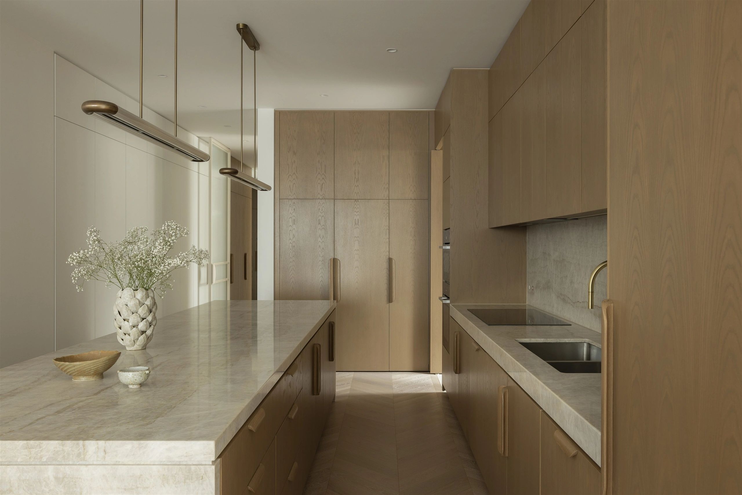 Manhattan Residence kitchen with stone island and timber joinery. Photography: Dylan James.