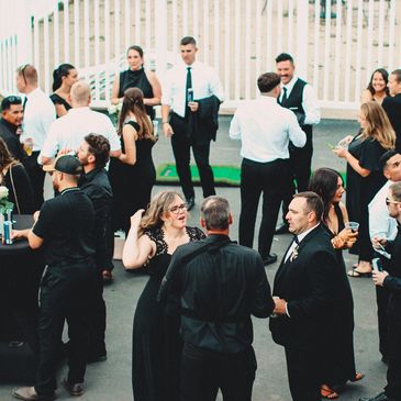 People gathering and having fun at a local medium size event.