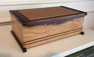 Stylized box made from cherry and black walnut.