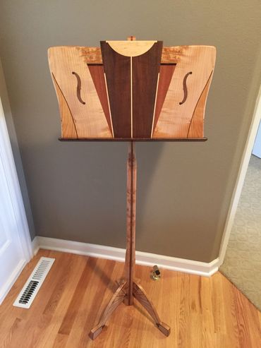 Adjustable music stand made from cherry, maple, sapele and black walnut.