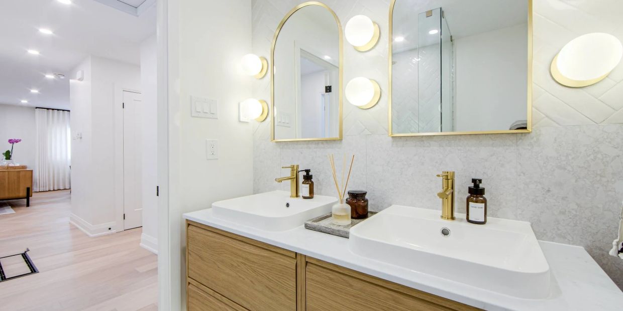 Completed bathroom renovation featuring a double wood vanity in North York.