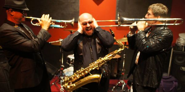 Two people playing trumpet in a person head