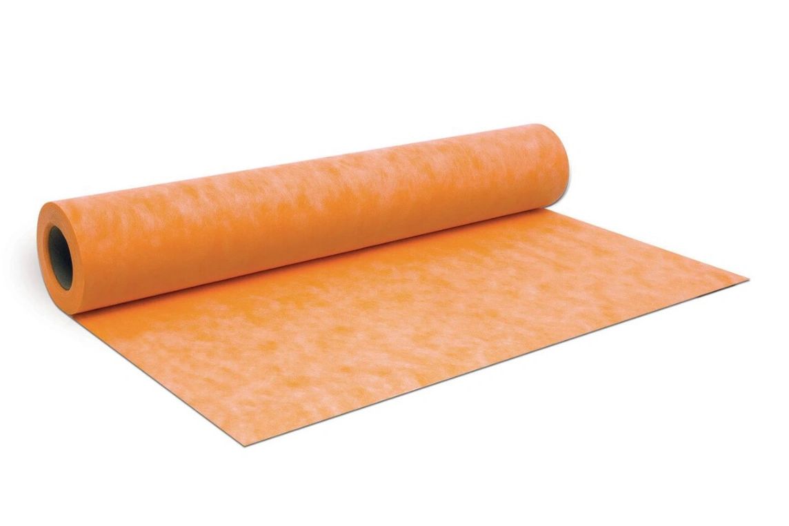 A roll of orange non-woven fabric partially unrolled.