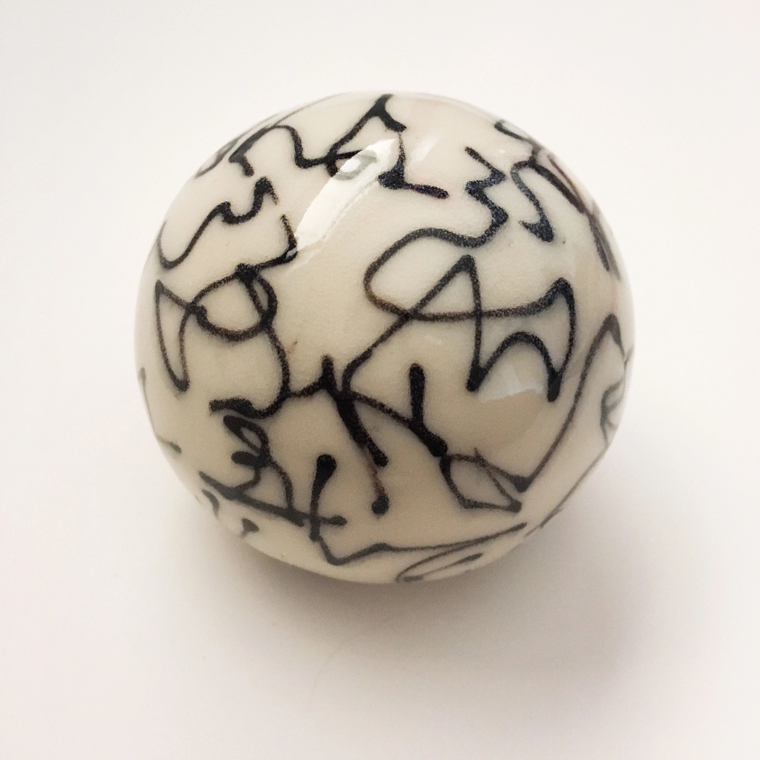 Palm sized porcelain sphere. Glazed. 2018.