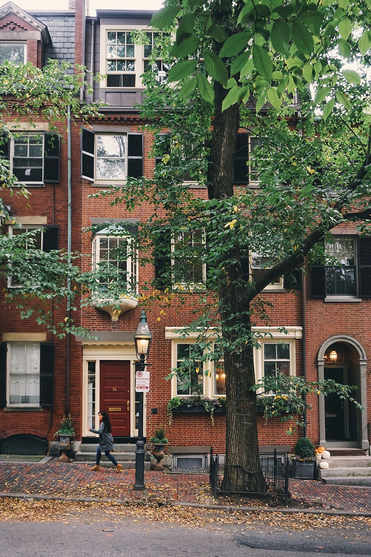 This picturesque street in Beacon Hill, Boston, captures the essence of fall with its historic red brick townhouses, tree-lined sidewalks, and classic gas lanterns. The neighborhood’s Federal-style architecture, charming window boxes, and cobblestone streets make it one of the most photogenic spots in the city. Whether you're strolling through during autumn or any season, Beacon Hill offers a timeless glimpse into Boston’s rich history. This picturesque street in Beacon Hill, Boston, captures the essence of fall with its historic red brick townhouses, tree-lined sidewalks, and classic gas lanterns. The neighborhood’s Federal-style architecture, charming window boxes, and cobblestone streets make it one of the most photogenic spots in the city. Whether you're strolling through during autumn or any season, Beacon Hill offers a timeless glimpse into Boston’s rich history.