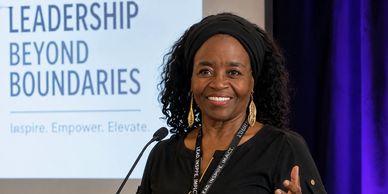 Woman speaking at a Leadership Beyond Boundaries event.