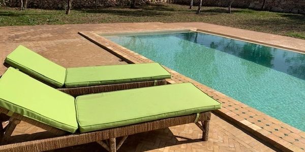 pool with two chairs
