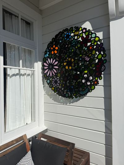 Large aluminium and stained glass floral wall-sculpture