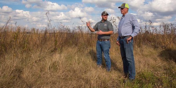 Quail Forever Biologist Wes Buchheit and landowner discussing quail and habitat