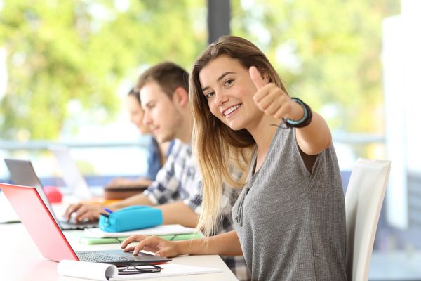 High School Girl Giving Thumbs Up in Class for Her Increased SAT Score. Walker Prep Reviews.