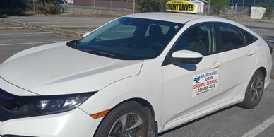 White student driver car from a driving school.