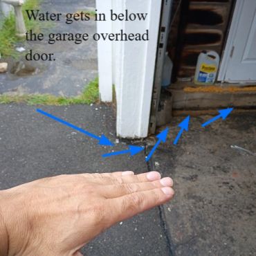 Water getting below a garage overhead door in Rochester NH