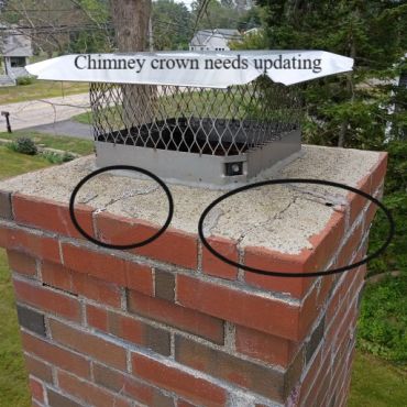 Chimney crown showing signs of age and erosion in York Maine.