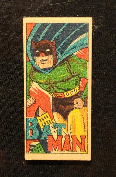 Vintage Batman comic card with classic colorful artwork and bold lettering.