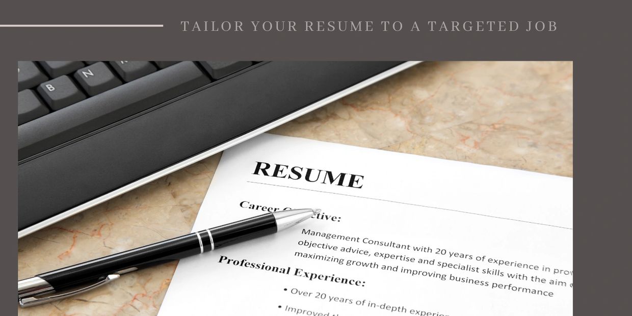 A close-up of a resume with the word "RESUME" highlighted
