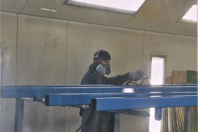 MTW Manufacturing Employee Painting Parts 