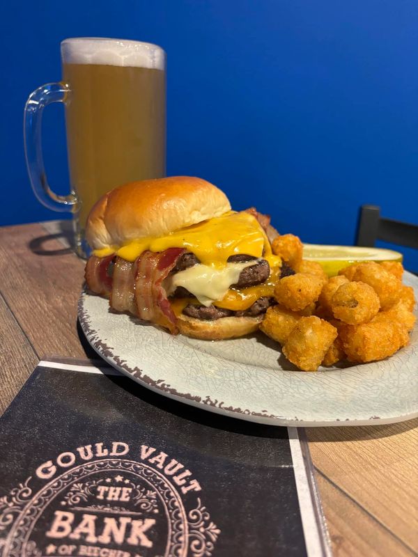 Triple Cheeseburger with tater tots on the side in Beecher Illinois