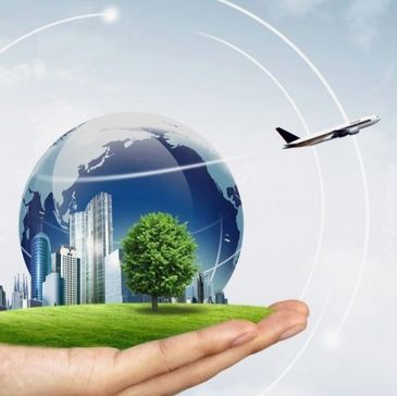 Hand holds a globe with cityscape, tree, and airplane symbolizing global connectivity and sustainability.