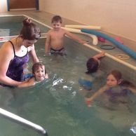 Children learning the basic principles of swimming.