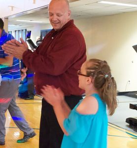 Fathers and Daughters enjoy music and dancing.
