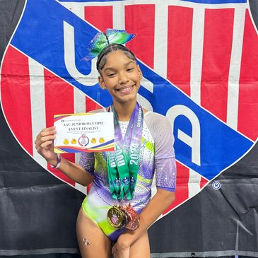 a girl posing with her medal