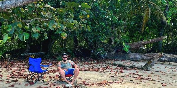 Happy client relaxing on the beach Punta Uva Puerto Viejo Costa Rica.